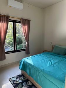 Ένα ή περισσότερα κρεβάτια σε δωμάτιο στο Vamana House