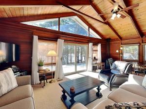 a living room with a ceiling with a large window at Swans Nest in Swanton +38 photos