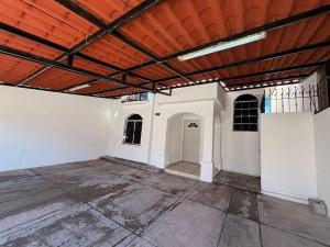 an empty room with white walls and a wooden ceiling at Casa Montebello in Los Mochis +2 photos