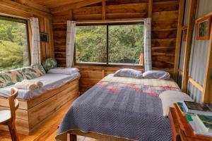 Postel nebo postele na pokoji v ubytování Campana Lodge n' Trails