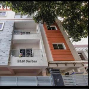 a building with a sign that reads slan suites at SLN Suites, Near Baptist Hospital, Hebbala in Bengaluru