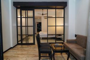 a living room with a couch and a table at Hotel Sun Shine Inn in Mumbai