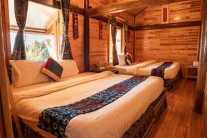 Postel nebo postele na pokoji v ubytování Hmong Farmstay