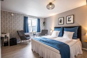 Postel nebo postele na pokoji v ubytování Marsk Hotellet