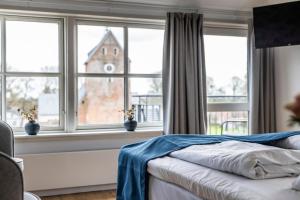 Postel nebo postele na pokoji v ubytování Marsk Hotellet
