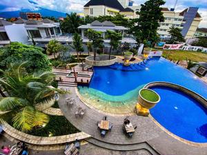 an overhead view of a swimming pool at a resort at Nemuru Grand Bhuvana Ciawi in Bogor