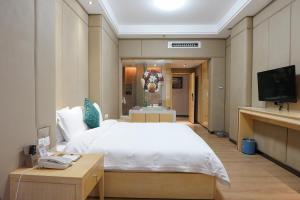 Postel nebo postele na pokoji v ubytování Paco Hotel Ouzhuang Metro Guangzhou-Free shuttle to Canton fair + 37 fotografií