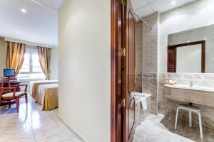Posteľ alebo postele v izbe v ubytovaní Roma Aurea