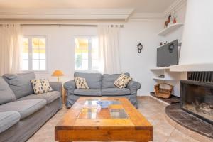 a living room with a couch and a coffee table at Casa Judith in Muro