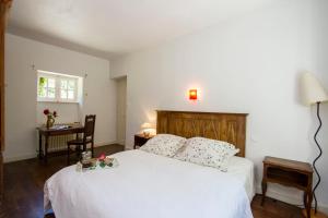 Ένα ή περισσότερα κρεβάτια σε δωμάτιο στο Tipoz'immo - maison familiale 10pax près de la plage de Kermor - jardin +26 φωτογραφίες