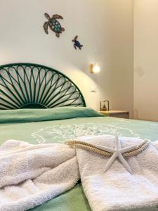 Postel nebo postele na pokoji v ubytování B&B Il Mare di Terrasini