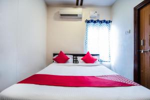 Hotel O Grand Brundavan客房内的一张或多张床位