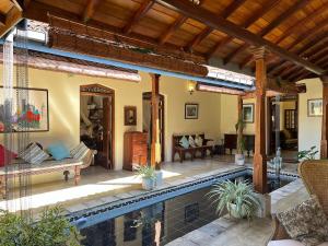 a house with a swimming pool and a patio at Samudrawasa Luxury Colonial Villa & Beach House in Ambalangoda