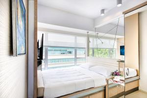 Letto o letti in una camera di Regal Riverside Hotel