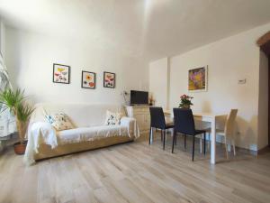 a living room with a couch and a table at Tuscany Hills La Veduta in Certaldo