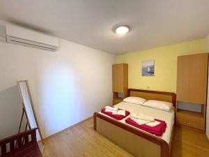 Posteľ alebo postele v izbe v ubytovaní Apartments Capic Z