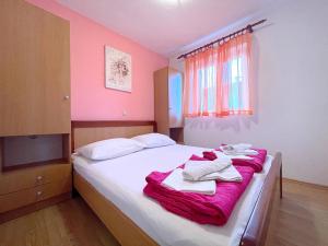 Posteľ alebo postele v izbe v ubytovaní Apartments Capic Z
