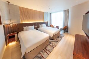Hotel Springs Makuhari Premier客房内的一张或多张床位