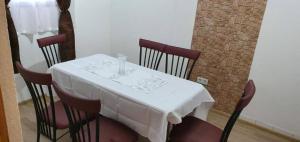 a table with a white table cloth on it at Luxury Villa Tale - Una in Ripač +20 photos