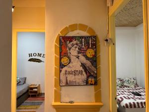 a hallway with a picture of a woman on the wall at Đưa Nhau Đi Trốn in Xuan An +10 photos