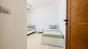 Postel nebo postele na pokoji v ubytování Yasmine villas