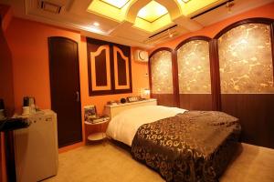 Ένα ή περισσότερα κρεβάτια σε δωμάτιο στο Hotel OLDSWING Adult Only