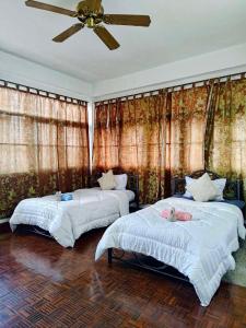 En eller flere senge i et værelse på Bestiehome Women Only