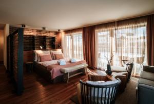 Postel nebo postele na pokoji v ubytování Boutique Hotel Das Rivus