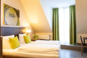 Postel nebo postele na pokoji v ubytování Hotel Aulmann