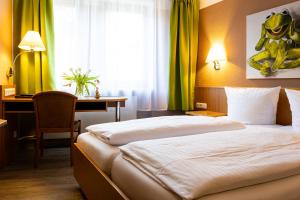 Postel nebo postele na pokoji v ubytování Hotel Aulmann