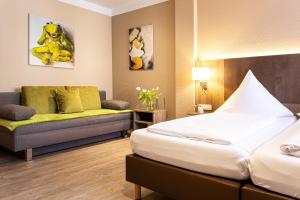 Postel nebo postele na pokoji v ubytování Hotel Aulmann