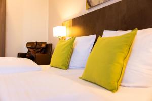 Postel nebo postele na pokoji v ubytování Hotel Aulmann