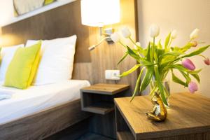 Postel nebo postele na pokoji v ubytování Hotel Aulmann