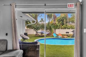 a view of a swimming pool from a house at Luxury Heated Pool Villa Hollywood Beach & Casino in Hollywood
