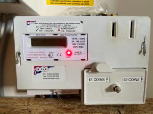 a white oven with stickers on the side of it at Chalet 149 Florida Holiday Park Hemsby in Hemsby