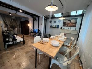 a dining room with a table and white chairs at 3 bedrooms 2 bathroom's in Bang Su