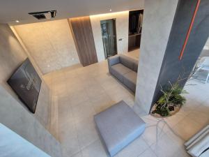 an overhead view of a living room with a couch at 펜톤나인 해변열차 송정2호점 in Busan
