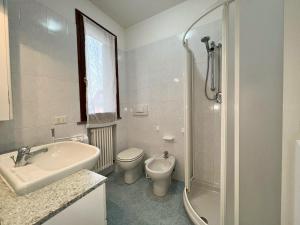a bathroom with a sink and a toilet and a shower at 48 Trilocale vista mare in Bellaria-Igea Marina +4 photos