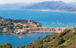 a view of a city with boats in the water at Casa Lilly in Varese Ligure
