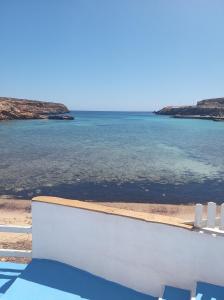 a view of the ocean from the balcony of a house at B&B Cala Pisana (Paola e Melo) in Lampedusa +17 photos