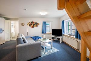 Μια τηλεόραση ή/και κέντρο ψυχαγωγίας στο Ferienwohnungen Andresen