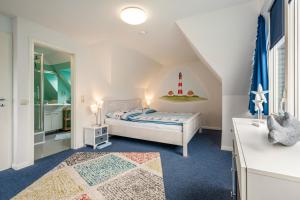 Ένα ή περισσότερα κρεβάτια σε δωμάτιο στο Ferienwohnungen Andresen