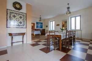 a kitchen and dining room with a table and chairs at - Luxury Villa Lunigiana Private Swimming Pool- in Bagnone
