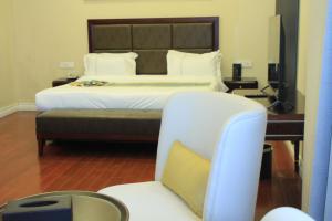 Omna Addis Hotel客房内的一张或多张床位