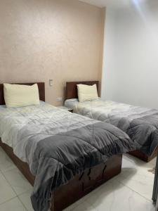 Letto o letti in una camera di Pyramids Home Guest House