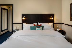 Voodi või voodid majutusasutuse Opera Hotel Zürich toas