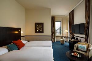 Voodi või voodid majutusasutuse Opera Hotel Zürich toas