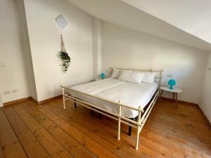 Ένα ή περισσότερα κρεβάτια σε δωμάτιο στο 71 Villetta indipendente con giardino