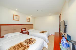 Katil atau katil-katil dalam bilik di Yiju Hotel Beijing South Railway Station Muxiyuan Branch