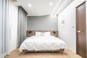 Letto o letti in una camera di 眺浪島民宿